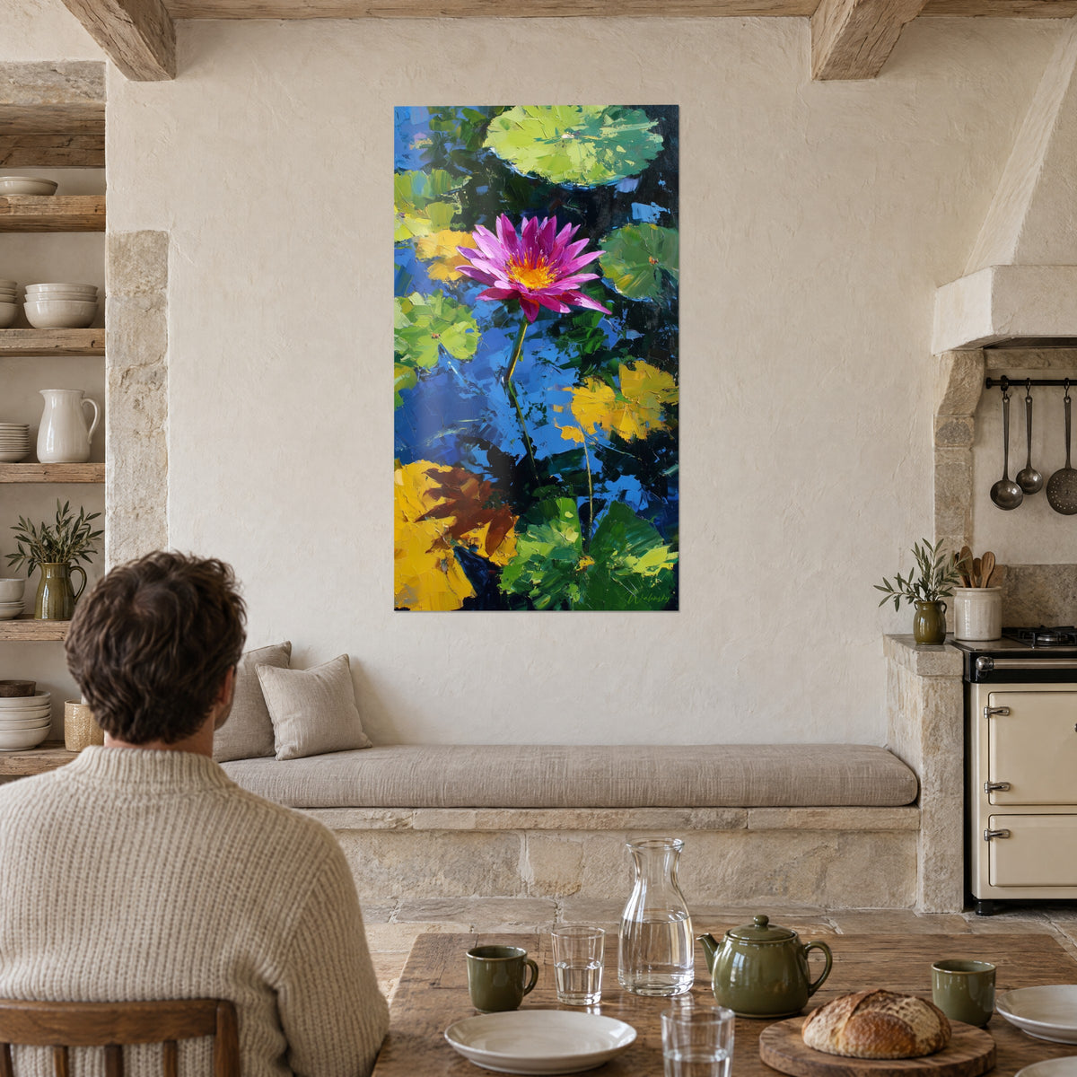 Wall art pond with thick palette-knife strokes, fuchsia lotus and mustard yellow leaves, facing a wooden farmhouse table