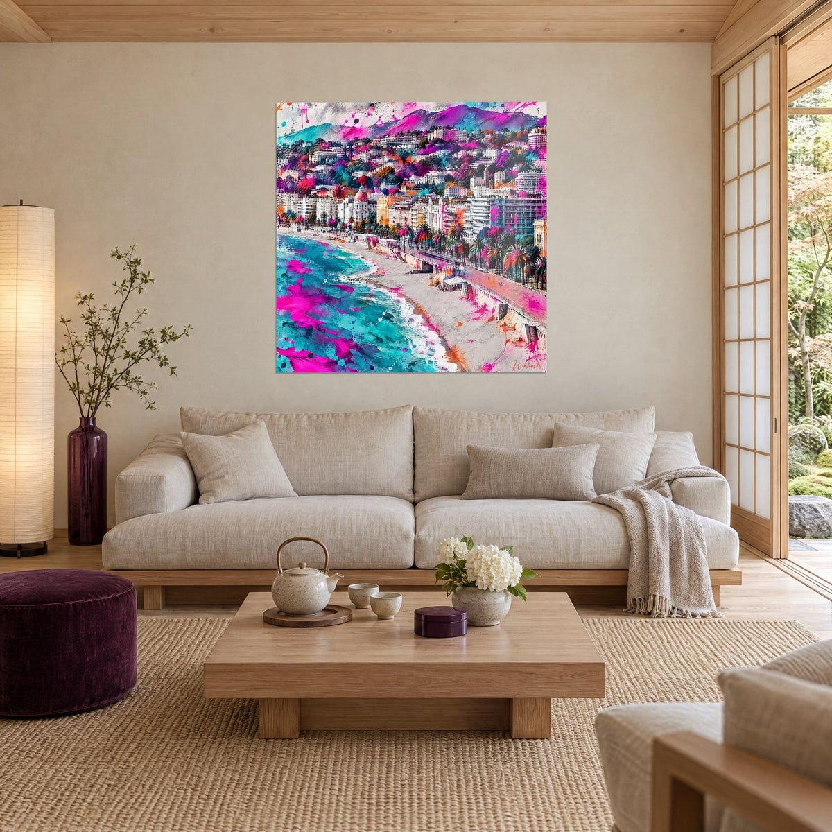 Wall art Promenade des Anglais in turquoise and fuchsia watercolour, palm trees, pink dome, above a sofa in a bright living room