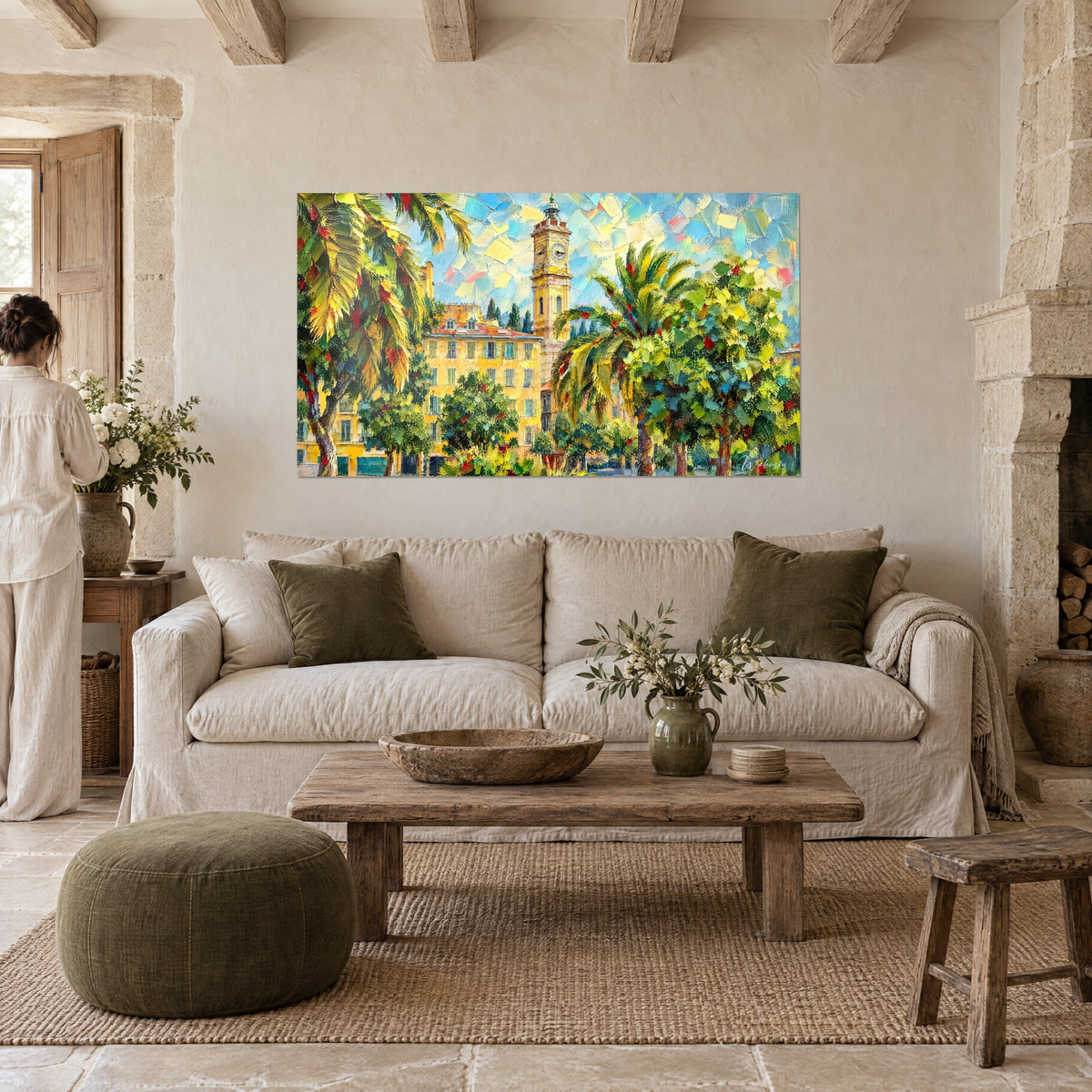 Wall art yellow bell tower with clock between golden palm fronds and green foliage, dabs of blue sky, above a sofa in a bright living room