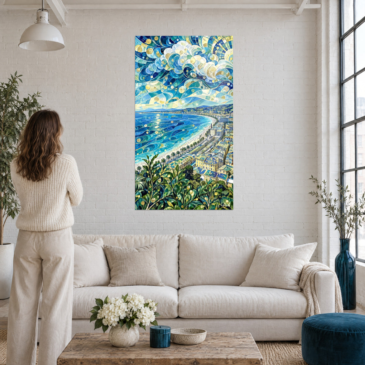 Wall art Nice bay mosaic in turquoise blue and gold, swirling clouds, above a sofa in a bright living room