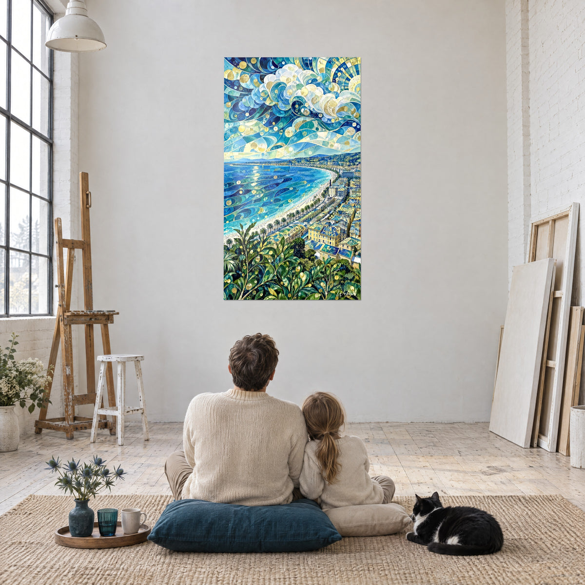 Wall art panorama of Nice in blue and gold stained glass, green leaves in the foreground, facing two people seated on the floor