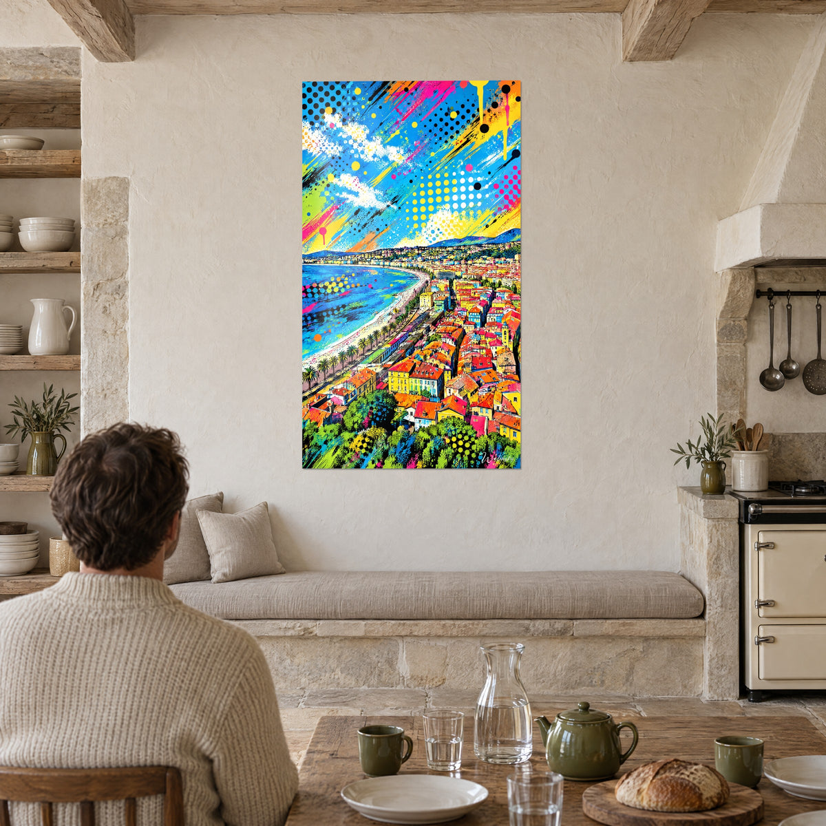 Wall art aerial view of Nice old town, red and orange rooftops, cobalt sea, one person seen from behind near the stone kitchen table