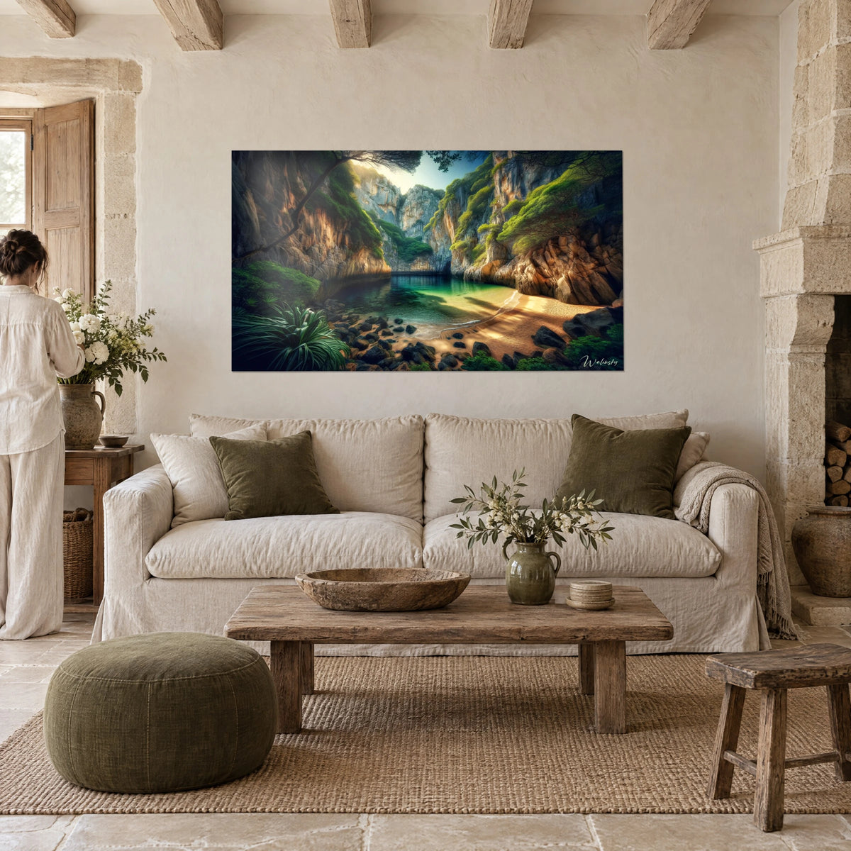 Wall art secret cove with ochre cliffs, emerald water and bright green moss, woman seen from behind, above a sofa in a bright living room