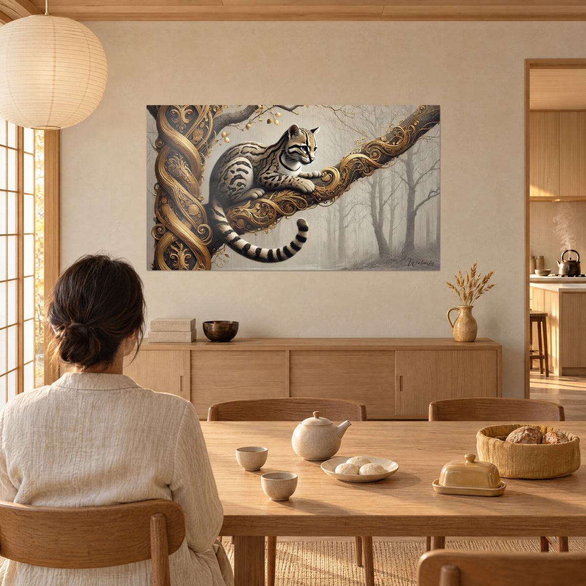 Wall art of an ocelot in a feline pose on a sculpted golden branch, grey and beige mist, facing a woman seen from behind near a dining table