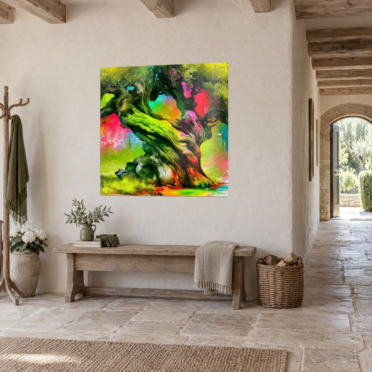 Wall art of a gnarled tree with apple-green and magenta twists, paint splashes, on a whitewashed wall of a stone house