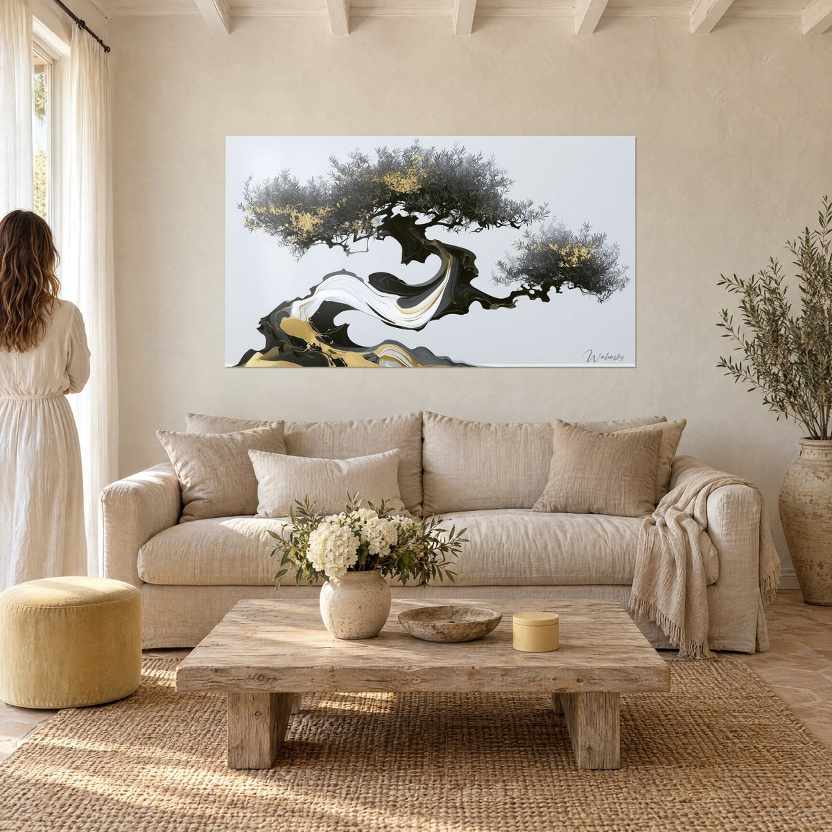 Wall art bonsai olive tree with silvery grey foliage and black and gold marbled trunk, above a sofa in a bright living room