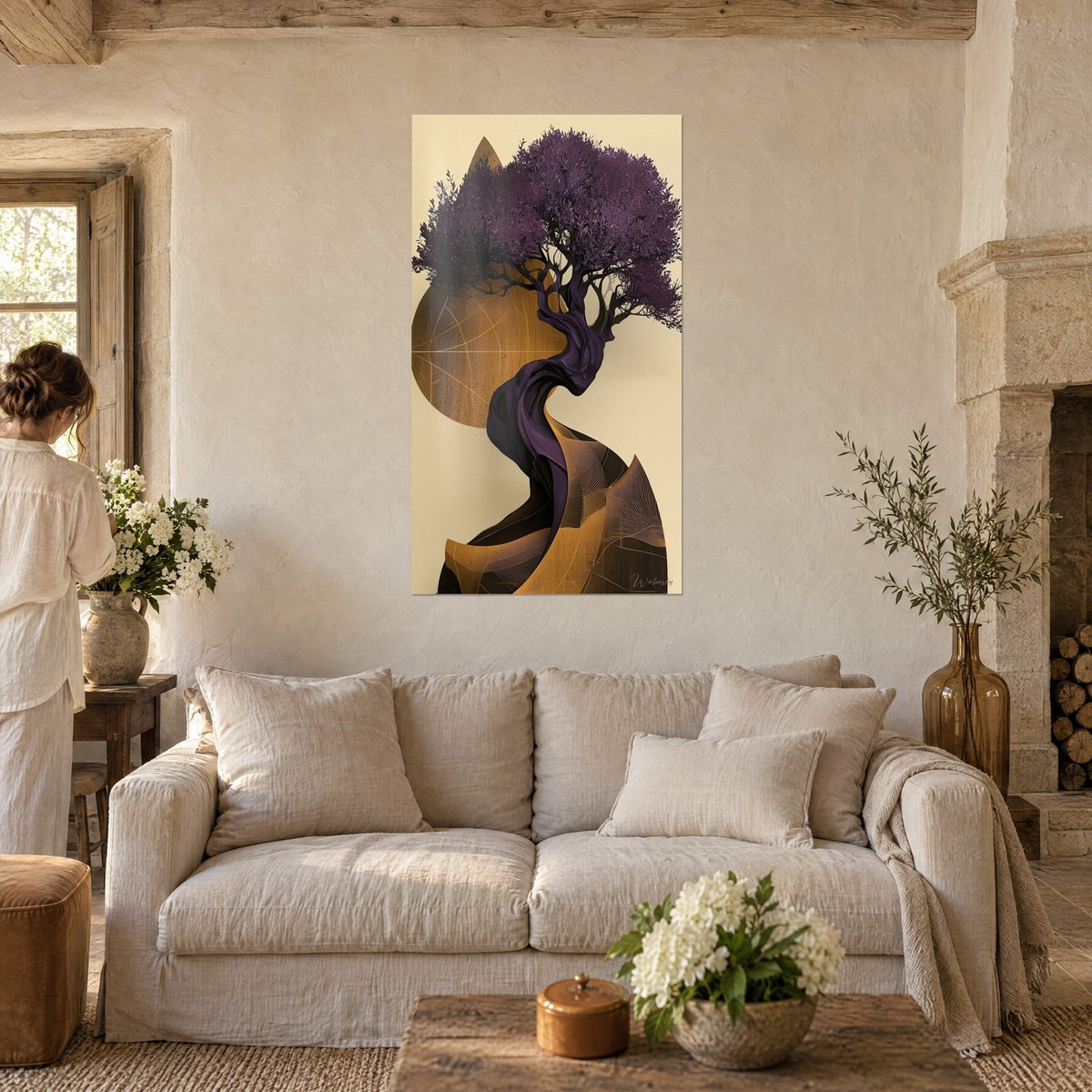 Wall art of a stylized olive tree with purple foliage on an ochre disc, spiral trunk, hanging above a sofa in a bright living room