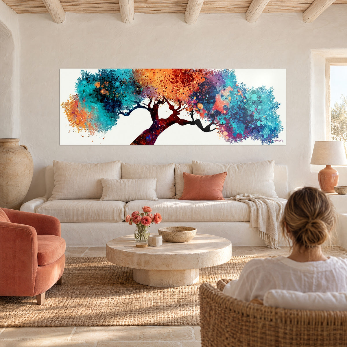 Wall art olive tree with turquoise and orange splattered leaves, burgundy trunk, above a sofa in a bright living room