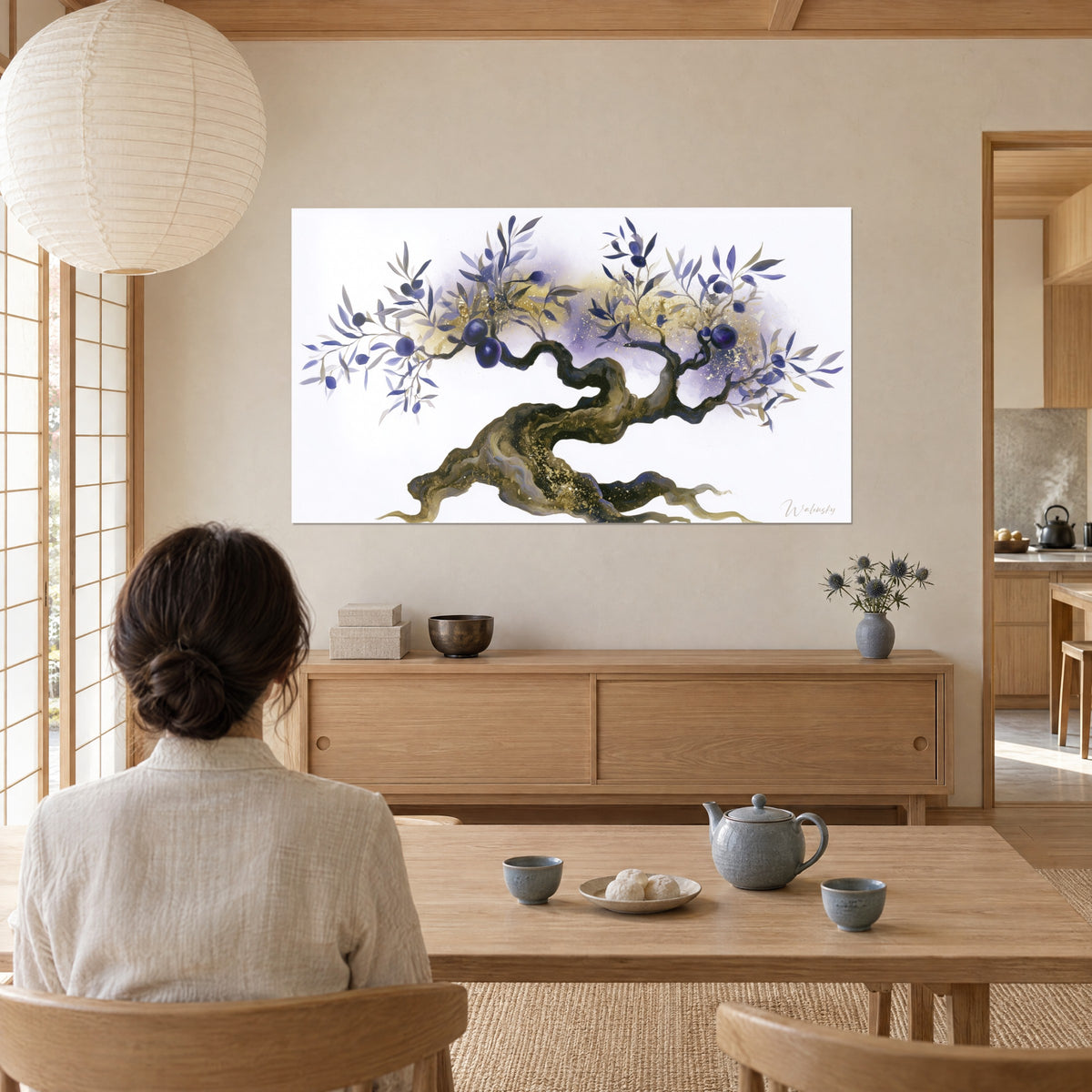 Wall art olive bonsai with golden roots, indigo olives and a violet veil, viewed by a woman seen from behind seated at a wooden tea table