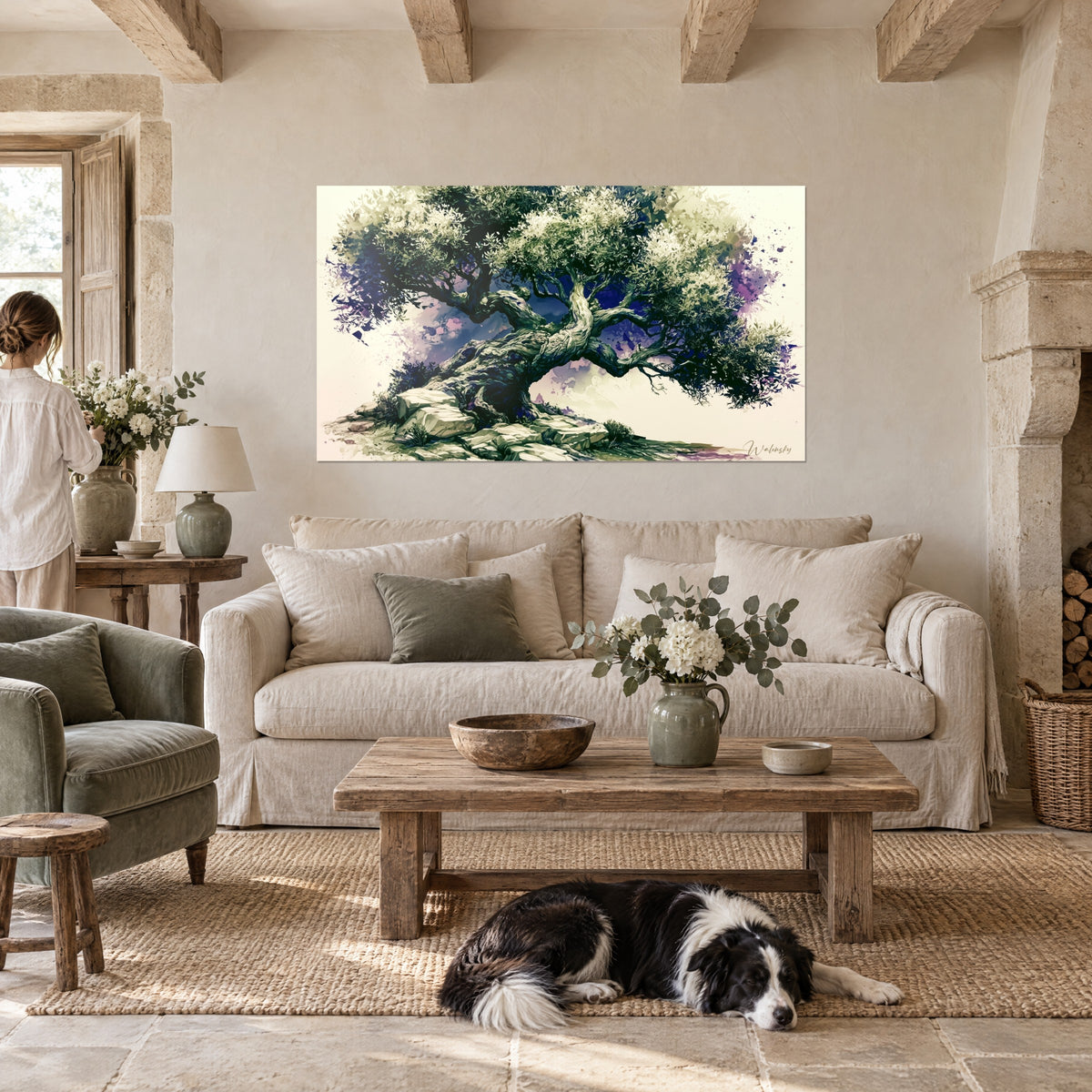 Schilderij knoestige olijfboom met groen gebladerte en paarse accenten, collie liggend op het kleed, boven een bank in een lichte woonkamer