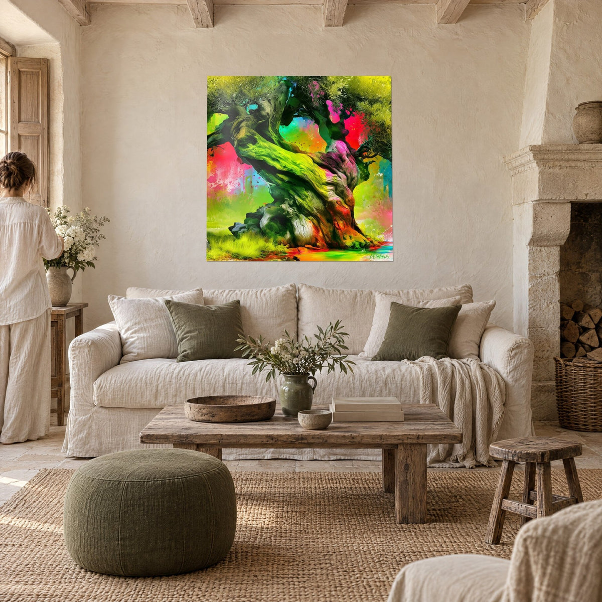 Wall art of a centuries-old olive tree with an aniseed-green and fuchsia trunk, orange and turquoise background, hung above a sofa in a bright living room