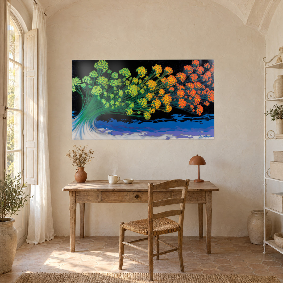 Wall art op art fan of lime and orange flowers on black background and blue foam, facing a light wood desk