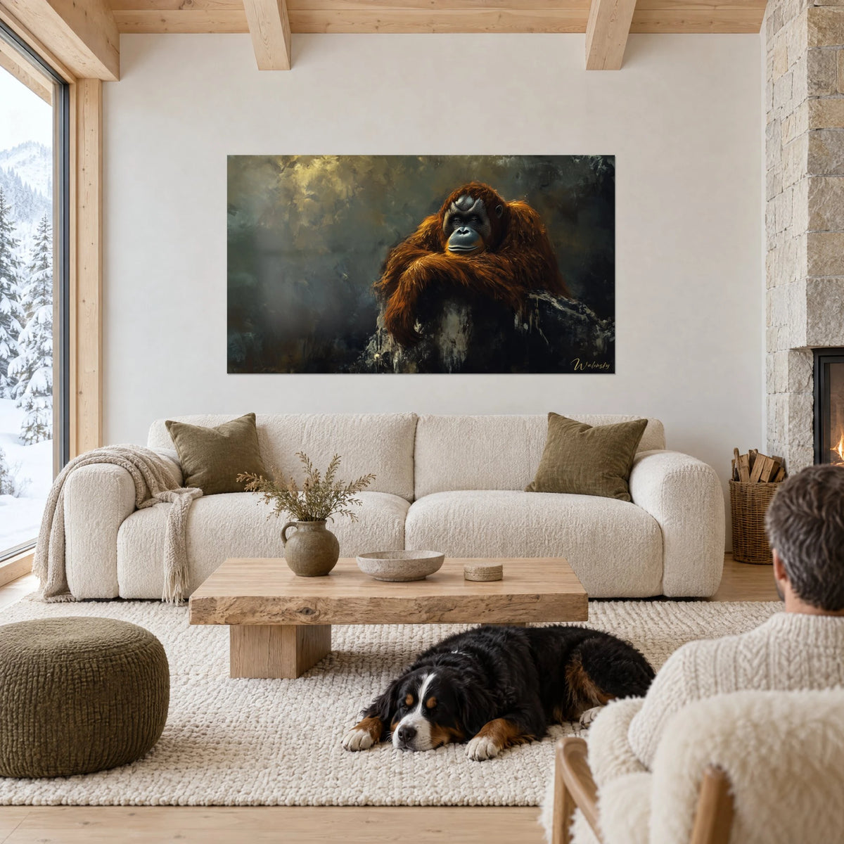 Tableau orang-outan au pelage roux, fond vert-de-gris, face au salon, un chien dort, au-dessus d'un canapé dans un salon lumineux