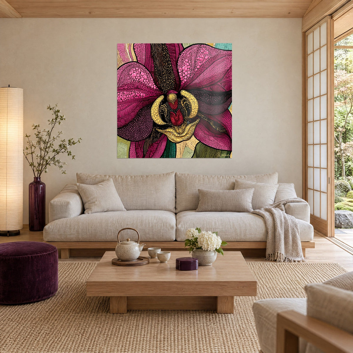 Wall art fuchsia orchid with pink and gold dotted petals, yellow centre edged in black, above a sofa in a bright living room