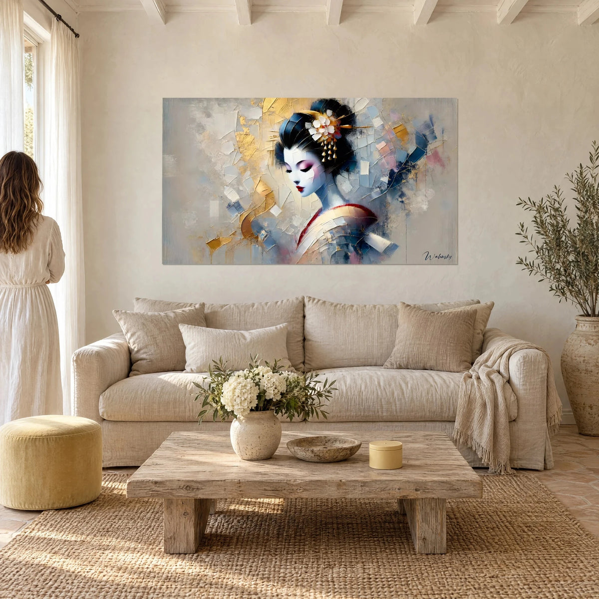 Wall art of a geisha with a porcelain face and white flowers in her bun, gold and blue palette knife strokes, above a sofa in a bright living room