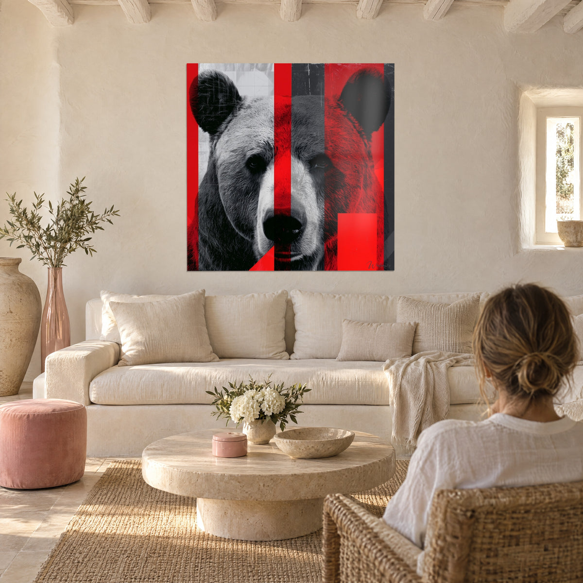 Wall art brown bear with a serious gaze, bright red and charcoal stripes, black and white fur, above a sofa in a bright living room