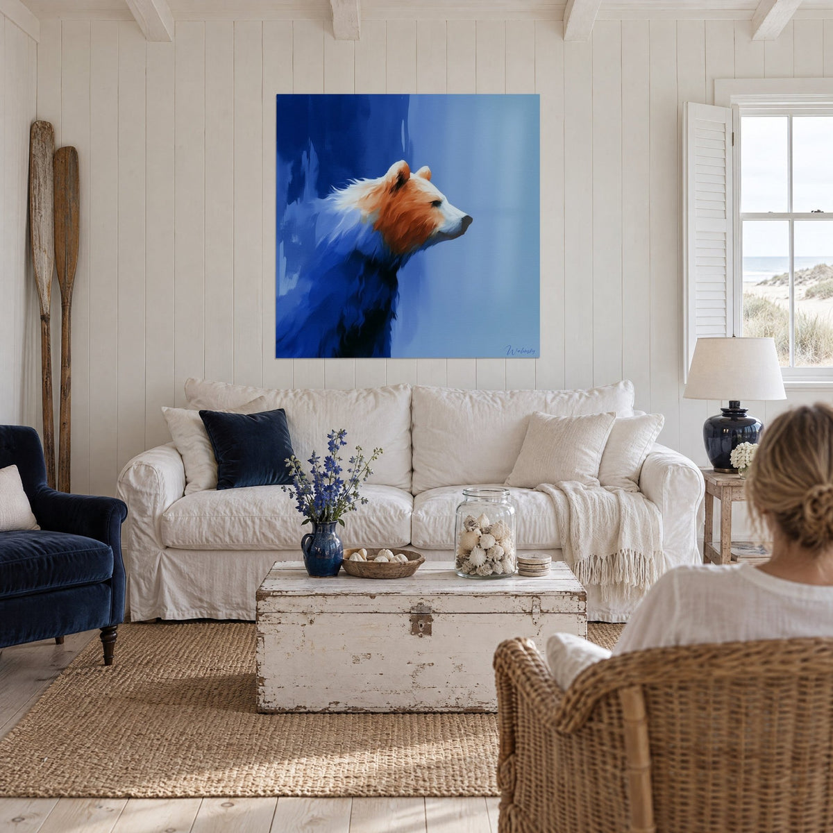 Wall art brown bear in profile, black muzzle raised, russet and midnight blue, above a sofa in a bright living room
