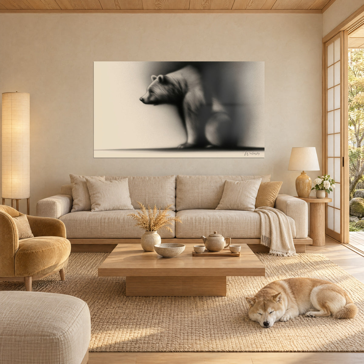 Wall art of a crouching bear in charcoal, anthracite grey fur on ivory background, muzzle turned left, sleeping Shiba, hung above a sofa in a bright living room