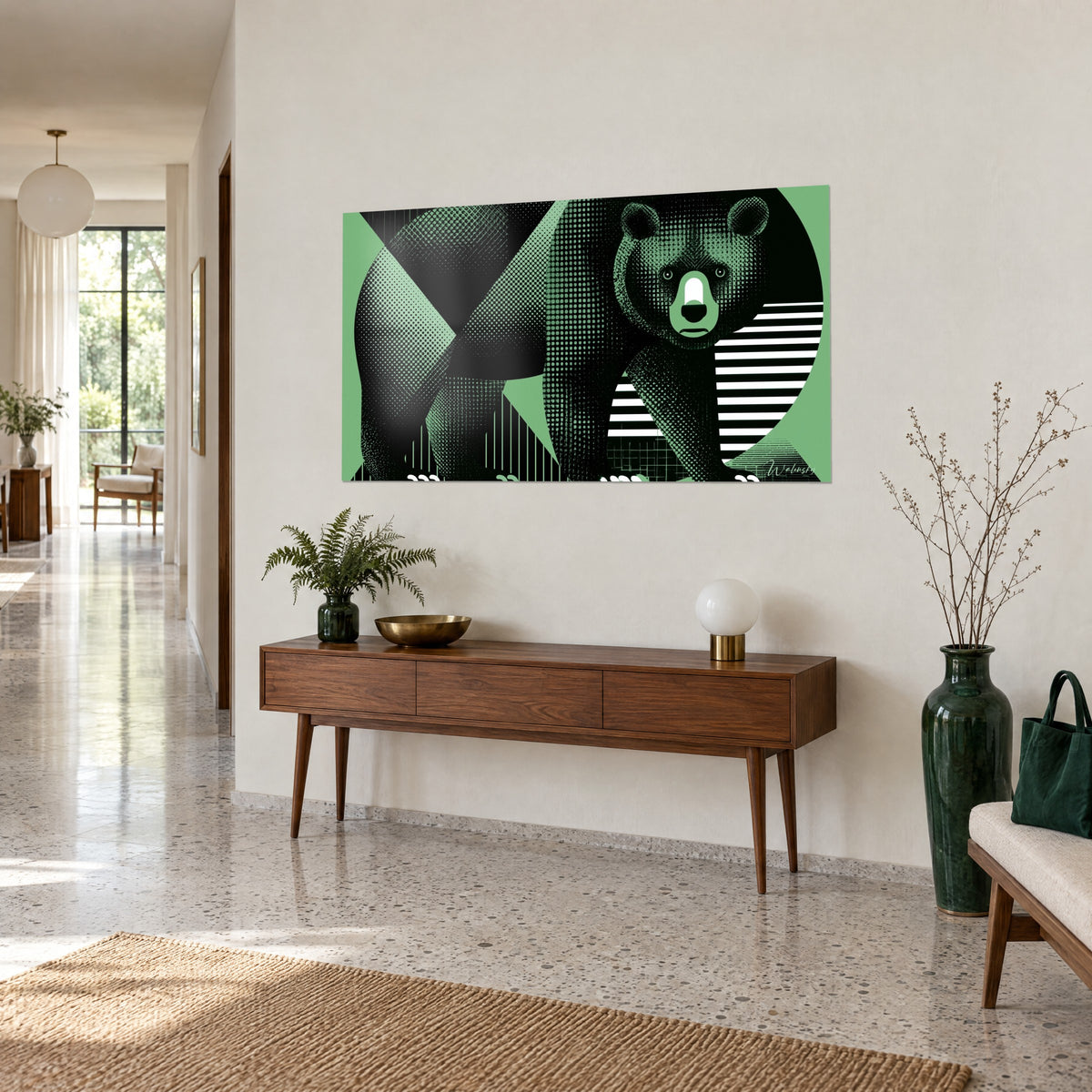 Cuadro silueta de oso en trama de puntos negros y círculo verde salvia, iluminado a tres cuartos sobre una consola de madera