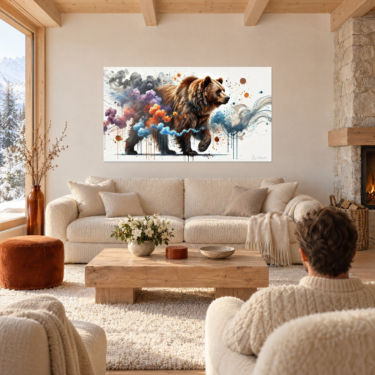 Wall art of a brown grizzly bear with copper-toned fur, blue and orange smoke plumes along its flank, two people seen from behind, above a sofa in a bright living room