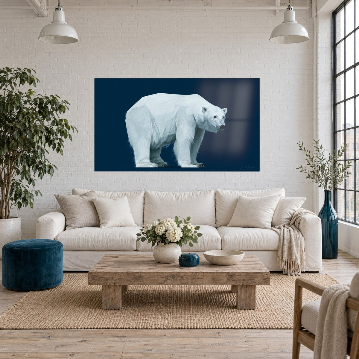 Wall art polar bear in white, icy facets on a midnight blue background, above a sofa in a bright living room