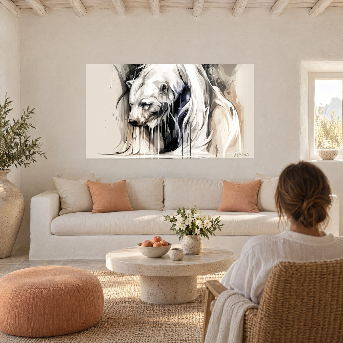 Wall art polar bear with white fur and anthracite drips, head lowered, beige background, above a sofa in a bright living room