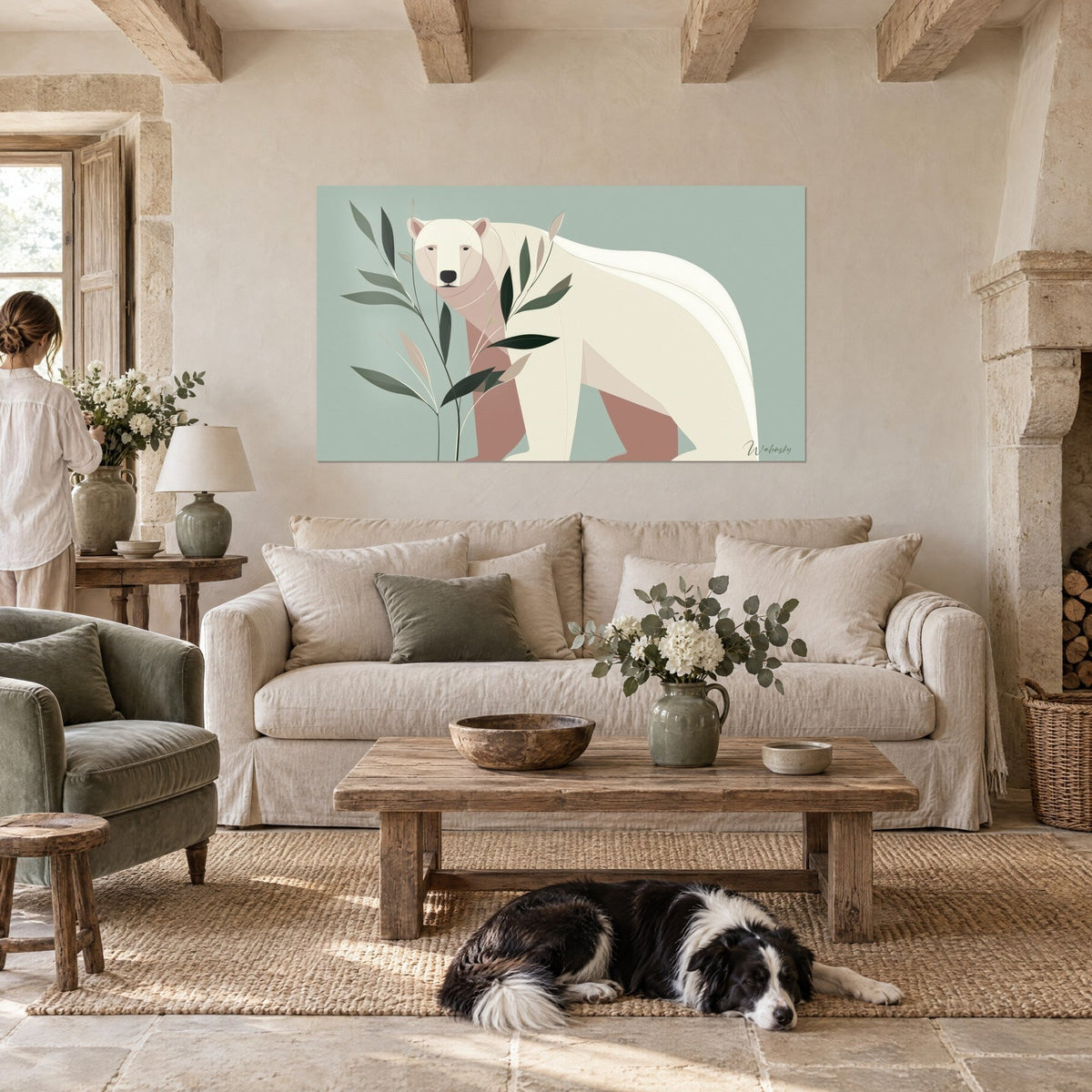 Wall art cream polar bear among sage green leaves on celadon background, lying collie, above a sofa in a bright living room
