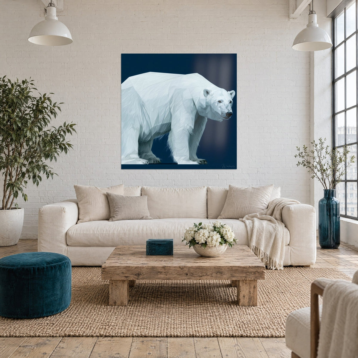 Wall art polar bear with frosted fur, navy blue background, hung on a white brick wall above a sofa in a bright living room