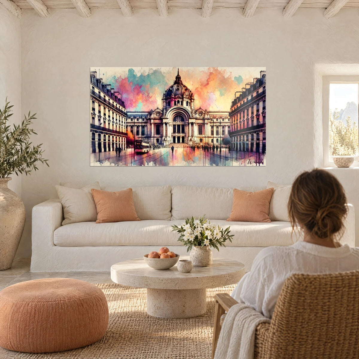 Wall art of a neo-baroque façade in pink and turquoise watercolour, dark dome, reflections on the pavement, above a sofa in a bright living room