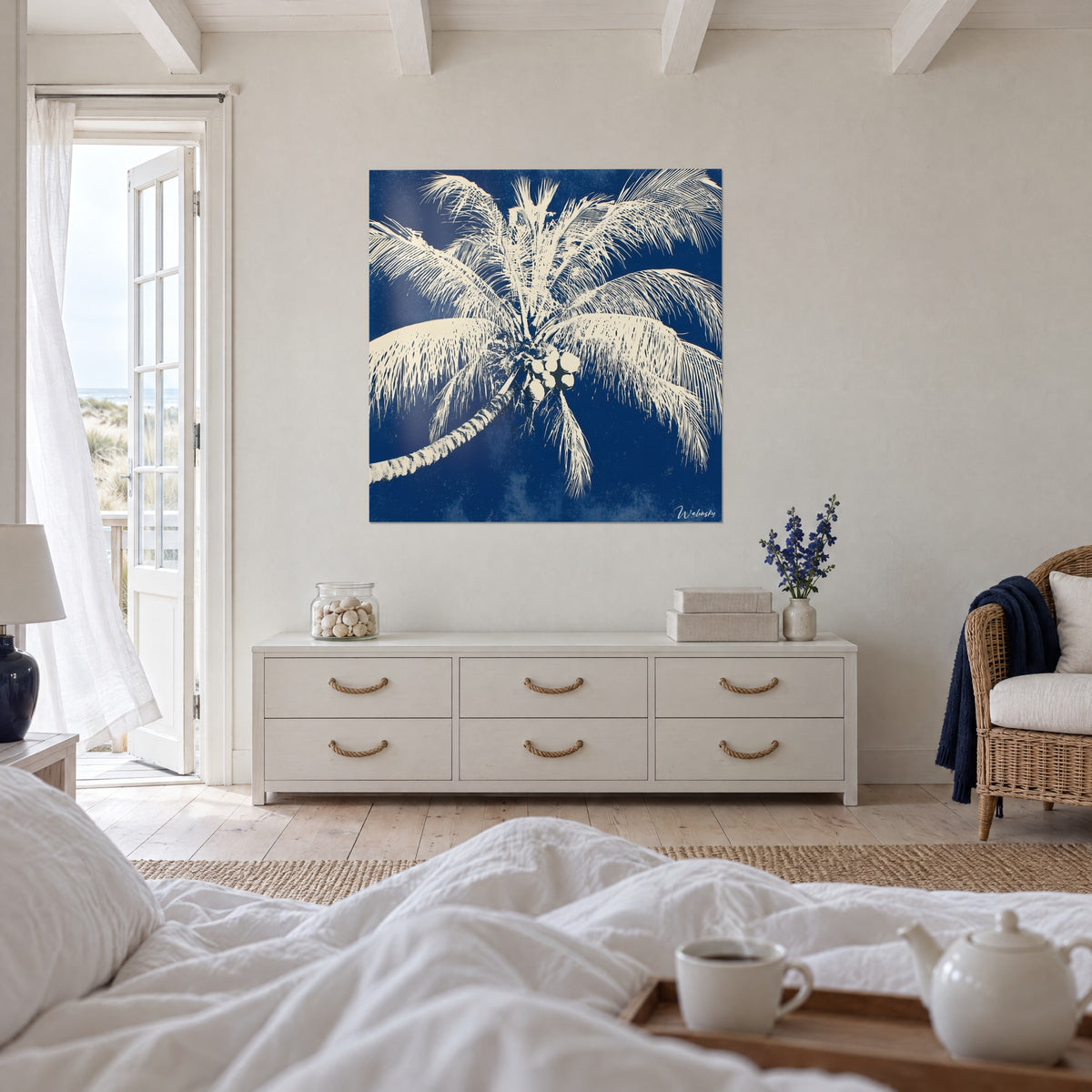 Wall art cream tropical tree on ultramarine sky, leaning trunk and coconuts, above a bed in a light bedroom