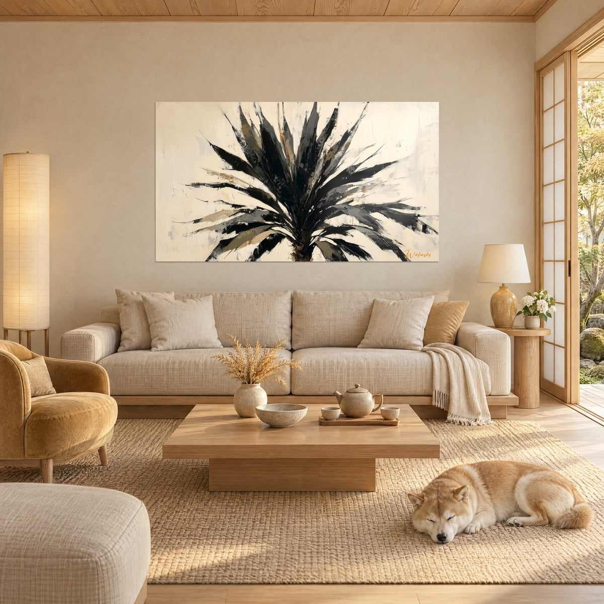 Wall art with splayed black palm fronds on ivory background, golden beige touches, a reclining Shiba above a sofa in a bright living room