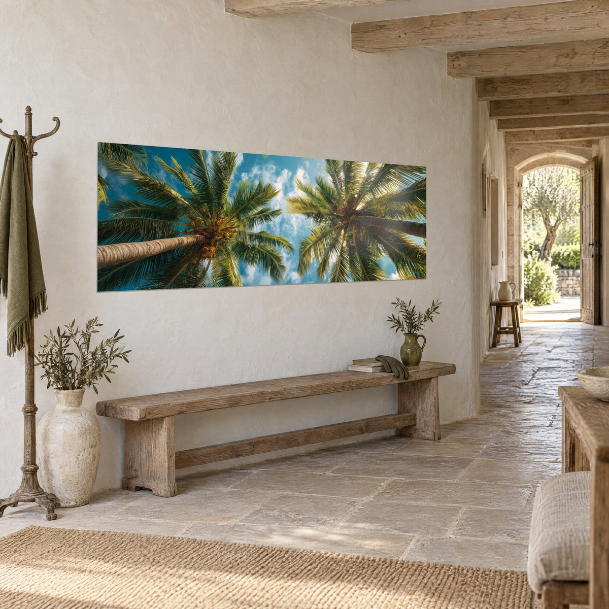 Wall art palm trees from a low angle, golden date clusters and white clouds, hung in a corridor with pale stone walls
