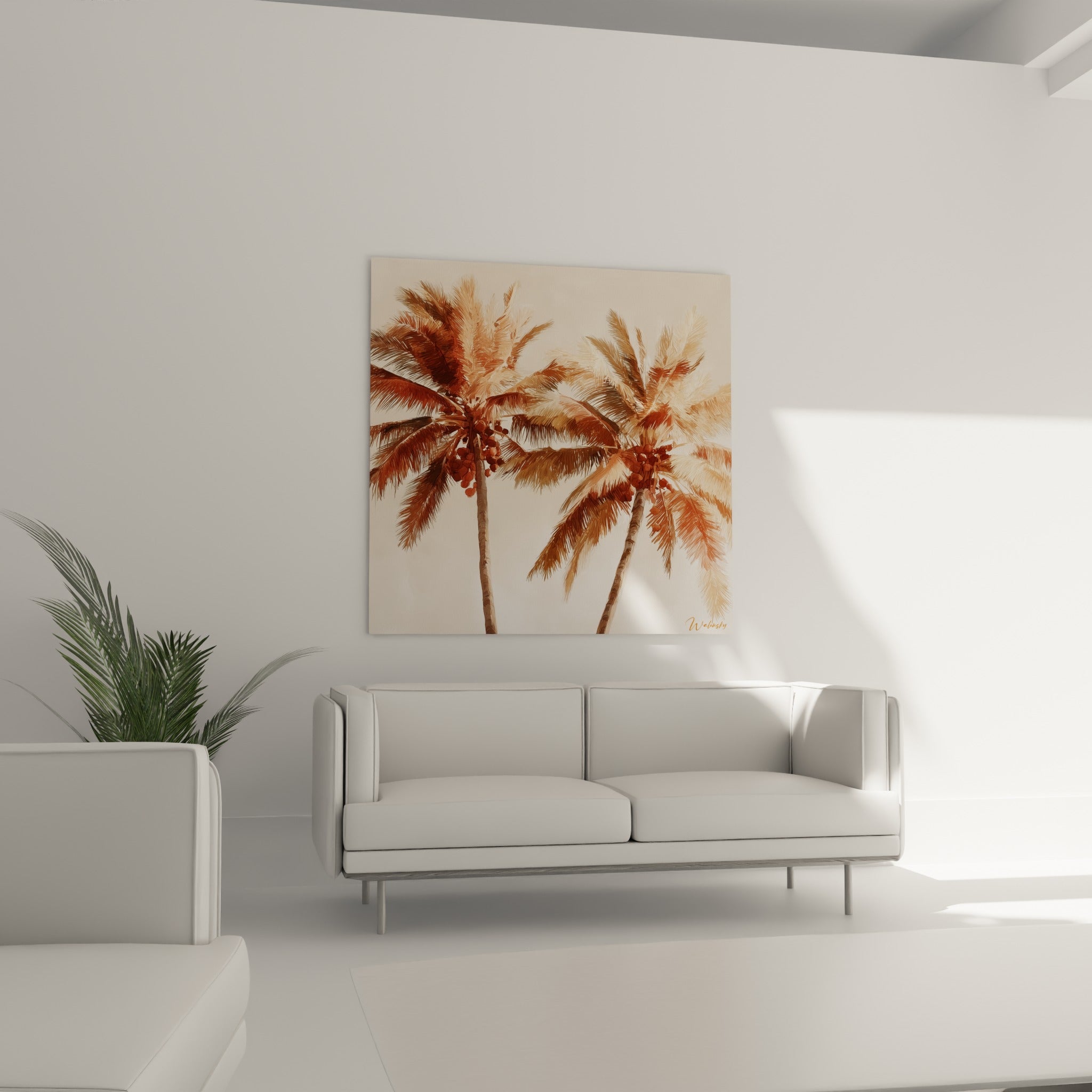 Feuillages terracotta et sable de palmiers accrochés au-dessus d'un canapé dans un salon lumineux