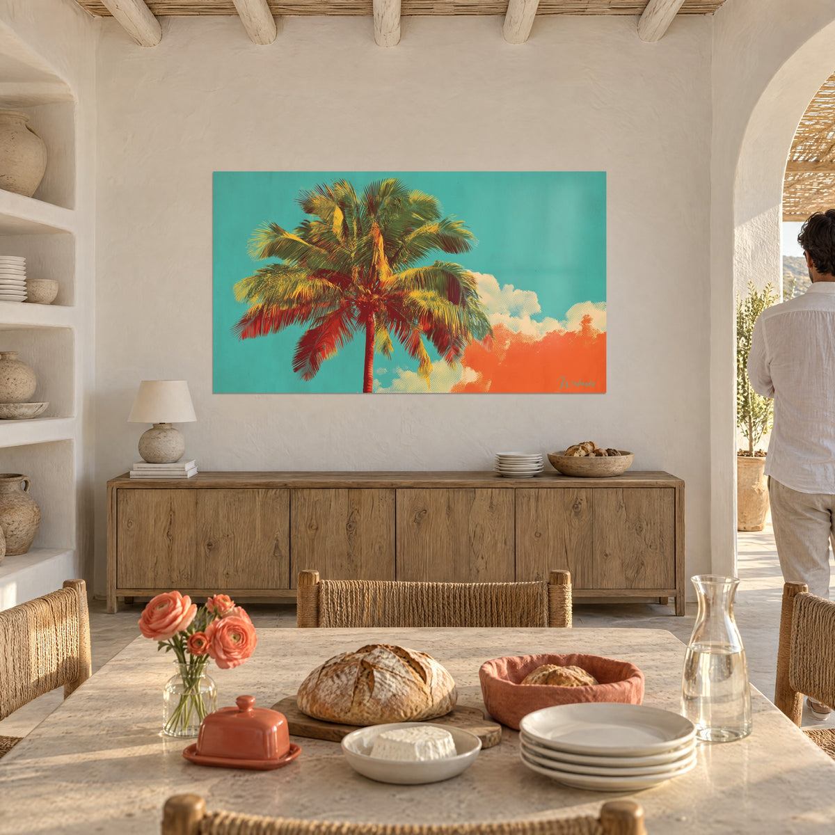 Wall art giant palm leaf in pop-art halftone dots, yellow and red foliage against a turquoise sky, couple seen from behind near a table in a dining room