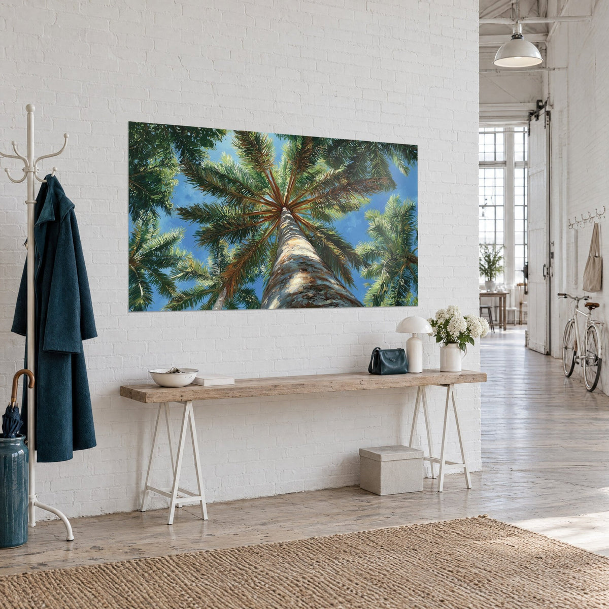 Wall art beige and brown peeled palm trunk leading up to emerald fronds, azure sky, white brick wall of an artist's loft