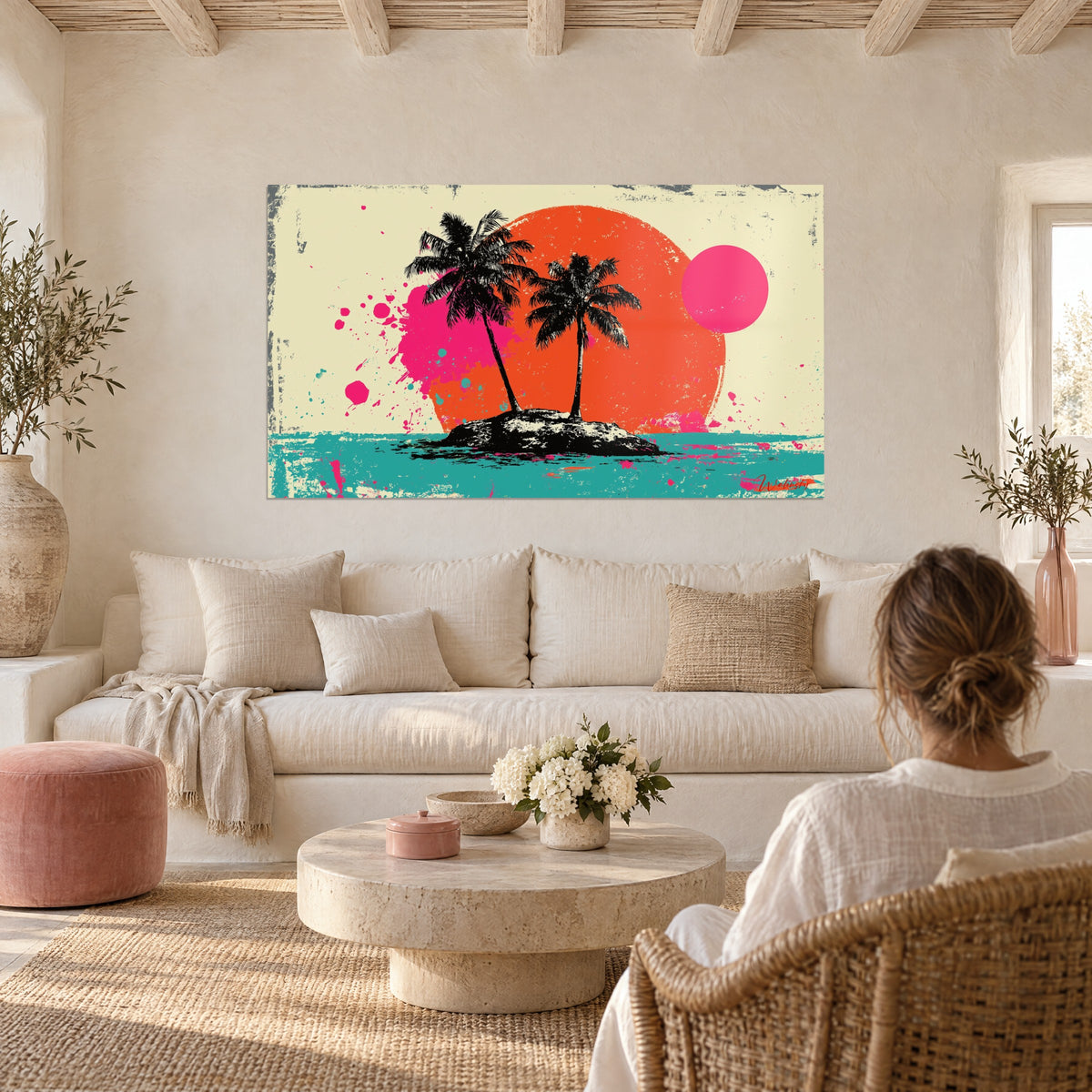 Wall art black islet with two palm trees on an orange disc, bright pink splashes, turquoise sea, above a sofa in a bright living room