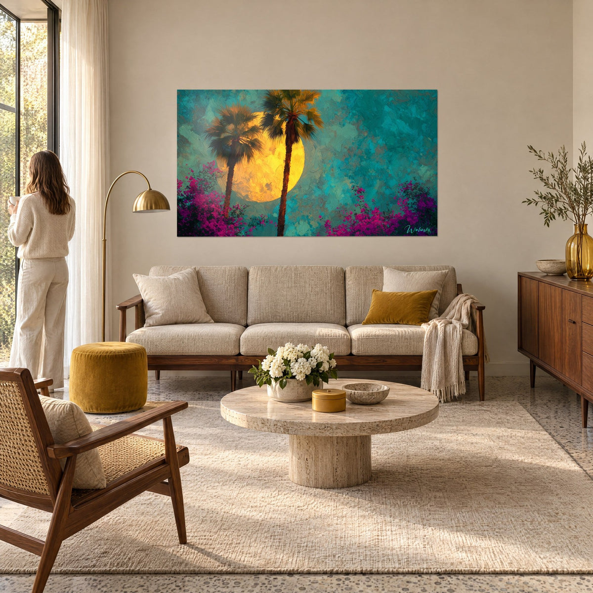 Wall art twin palm trees in turquoise and fuchsia in front of a golden moon, blooming bougainvillea, above a sofa in a bright living room