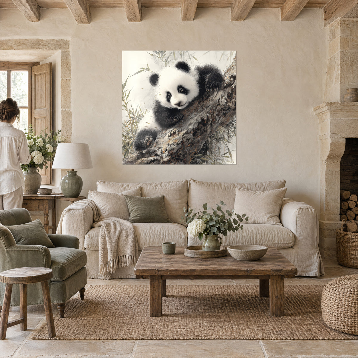 Wall art black and white panda cub cuddled against a tree trunk, golden bamboo, above a sofa in a bright living room