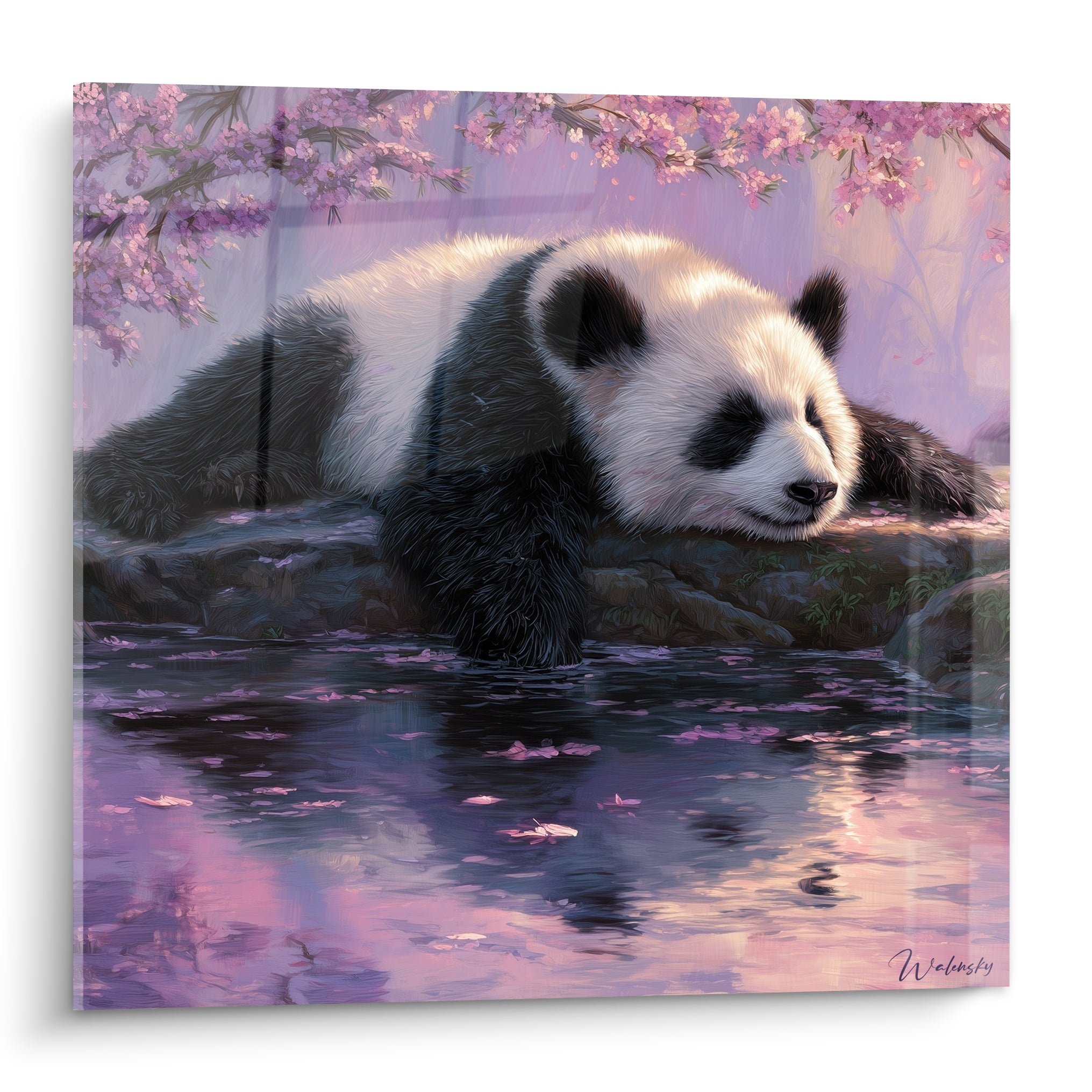 Panda blanc et noir endormi sous des branches de cerisier roses et mauves