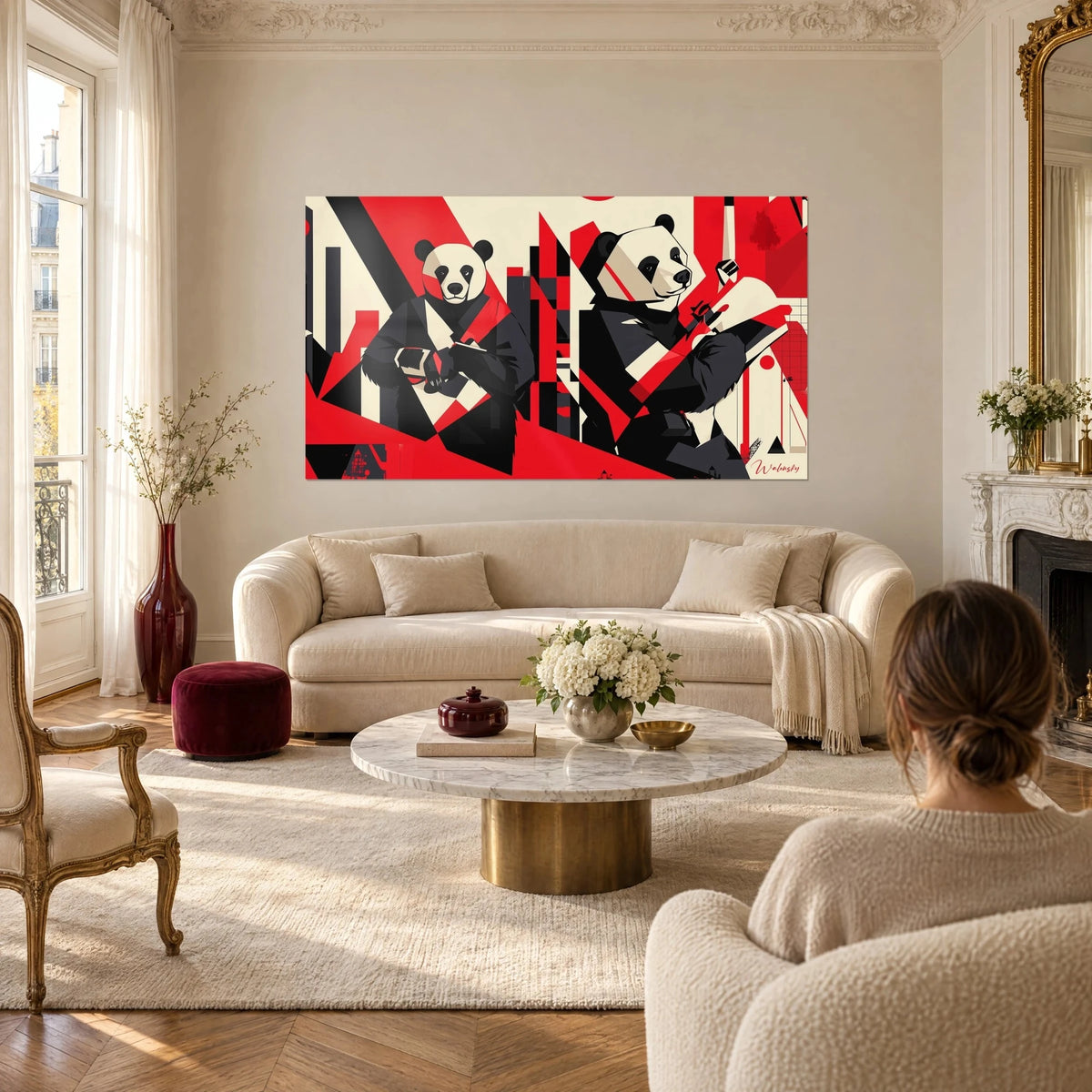 Wall art panda bear in a black kimono, bright red and cream stripes, two geometric silhouettes above a sofa in a bright living room
