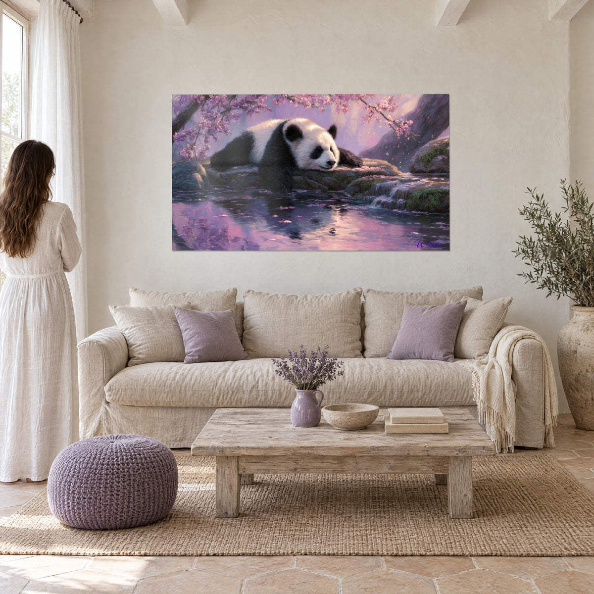 Wall art of a sleeping panda on a rock, pink cherry blossom petals and lilac reflections, above a sofa in a bright living room