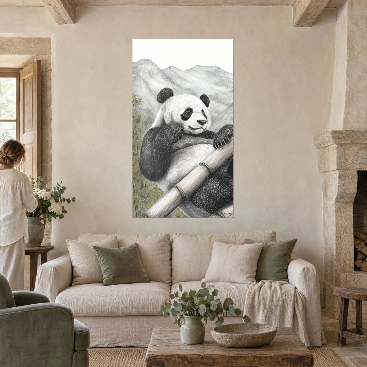 Wall art of a giant panda leaning against bamboo, black and white fur, grey mountains, above a sofa in a bright living room