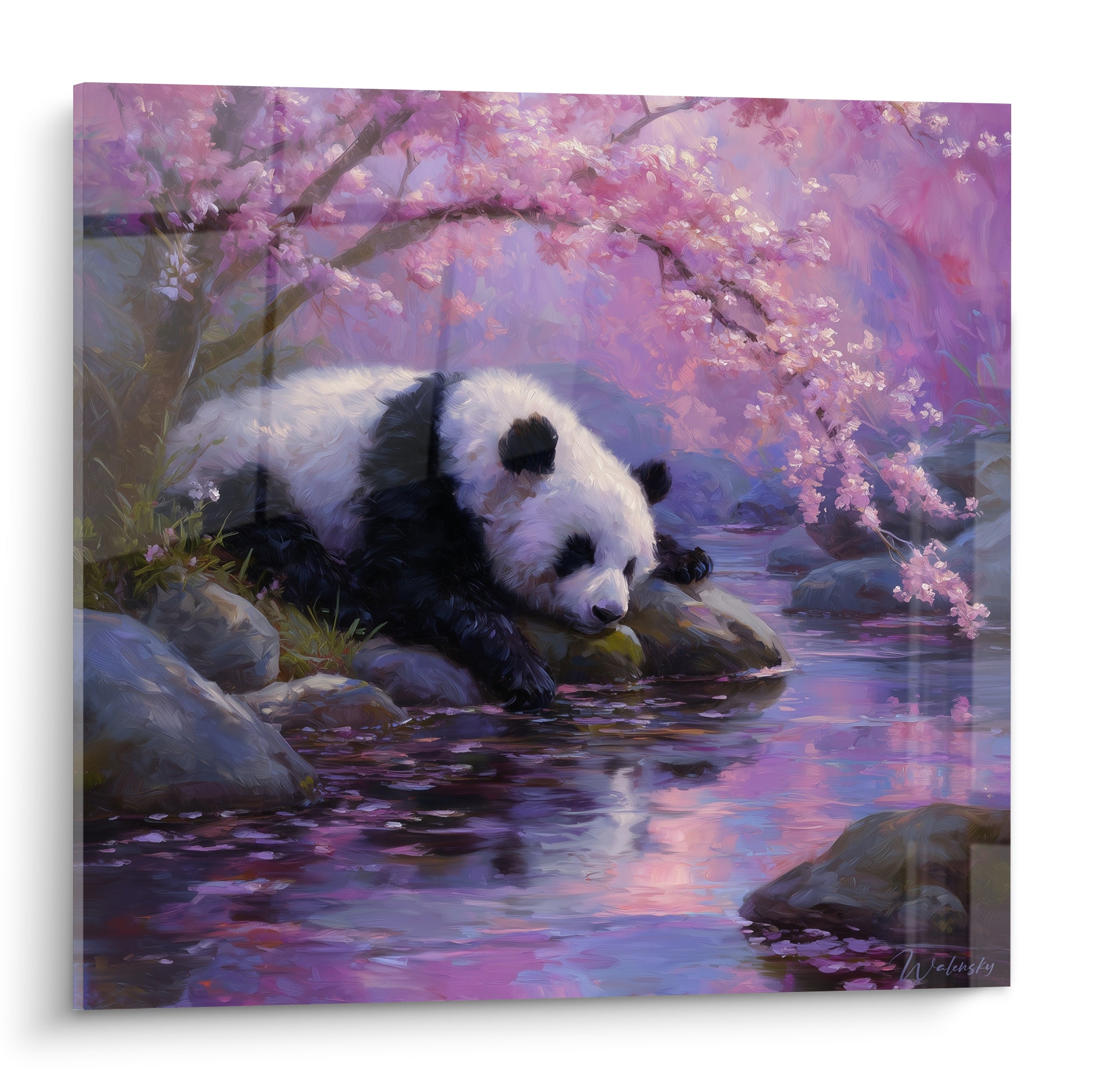 Panda noir et blanc allongé sur des rochers roses et violets sous des cerisiers en fleurs