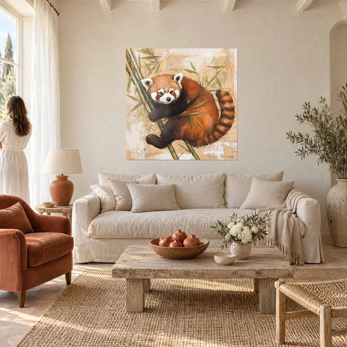 Wall art red panda clinging to bamboo stalks, orange and white fur on a beige background, above a sofa in a bright living room