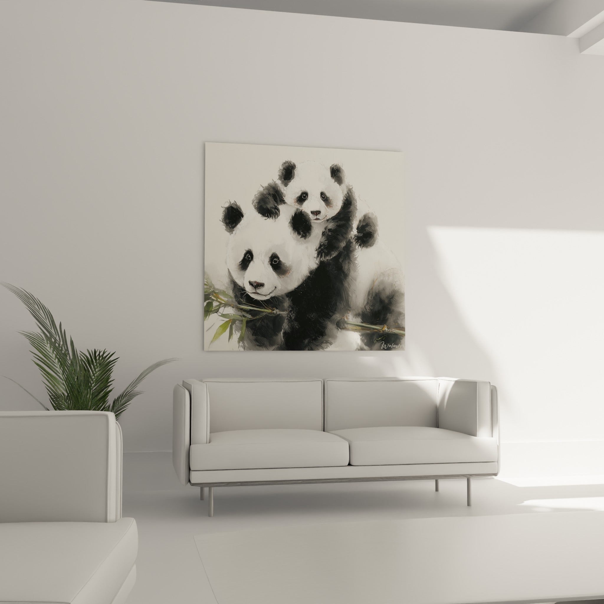 Pandas attendris aux tons noir et ivoire accrochés au-dessus d'un canapé dans un salon lumineux