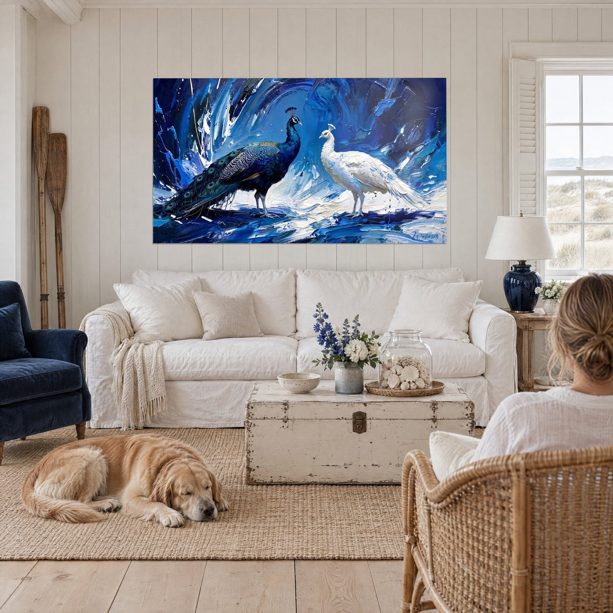 Wall art midnight-blue peacock with eyespot tail, facing his ivory peahen, sapphire palette-knife strokes, above a sofa in a bright living room