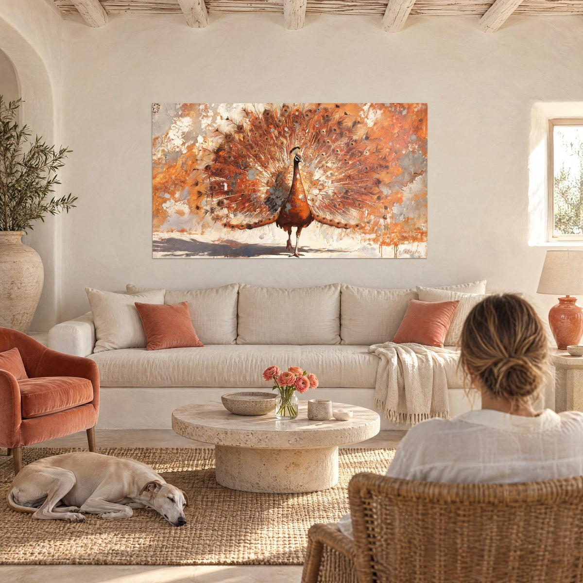 Wall art peacock fanning its tail, copper eyespots on a rusted grey background, above a sofa in a bright living room