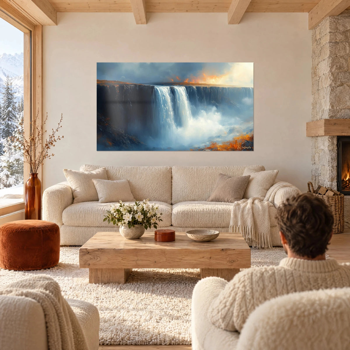 Tableau chute d'eau monumentale, écume blanche et falaise bleu nuit, deux personnes de dos au-dessus d'un canapé dans un salon lumineux