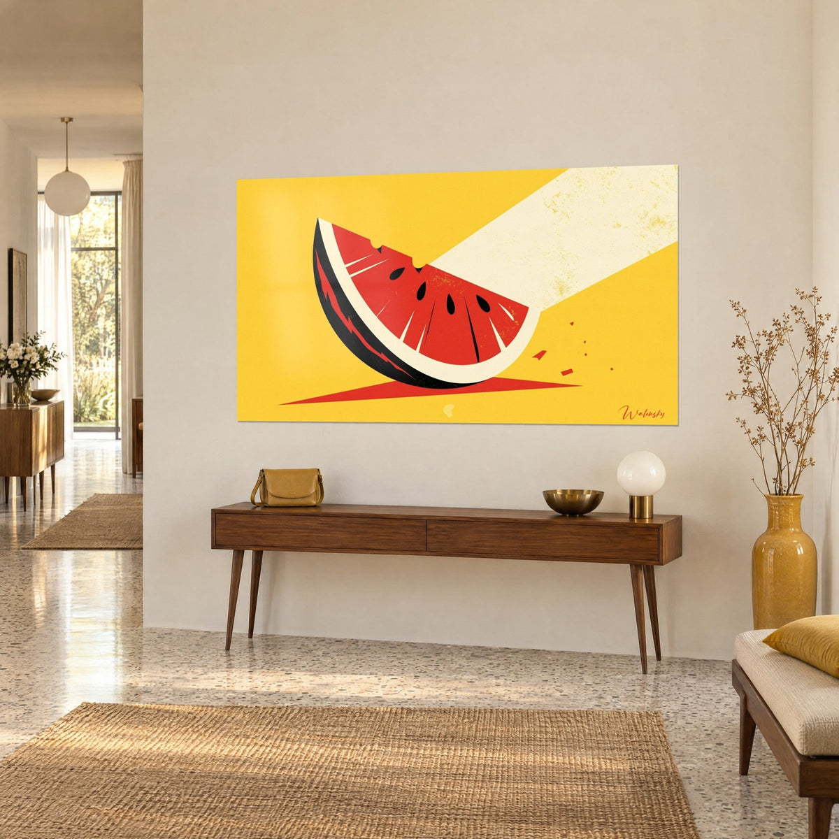 Wall art summer fruit with black and cream rind, vermilion flesh and seeds, hung on a beige wall above a wooden console