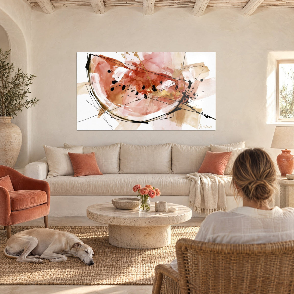 Wall art sketched watermelon slice in terracotta, black strokes and golden highlights, hung above a sofa in a bright living room